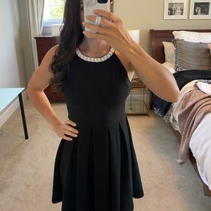 Black skater dress with white neckline beading